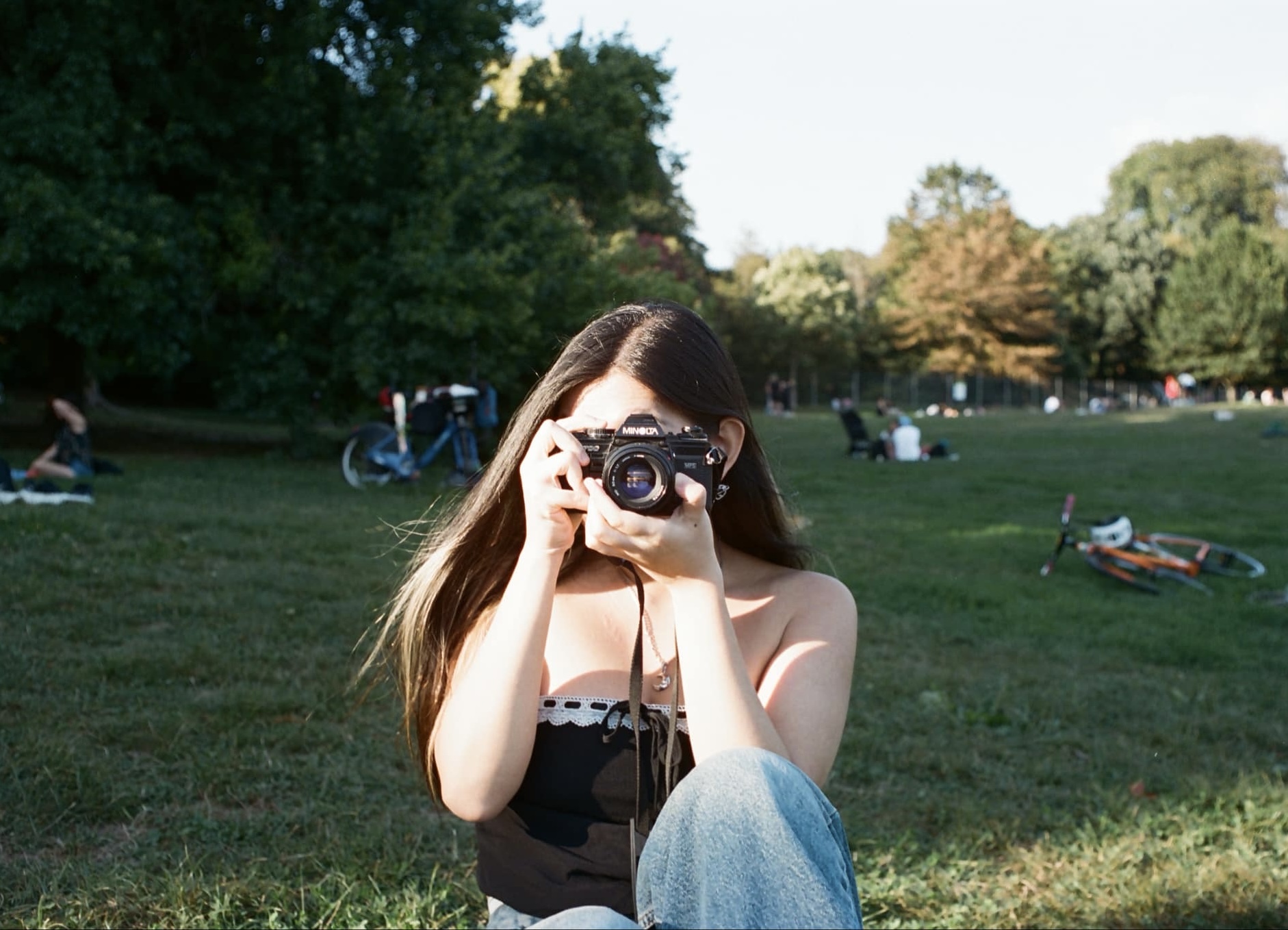 Nancy Jiang takes a photo on her film camera.